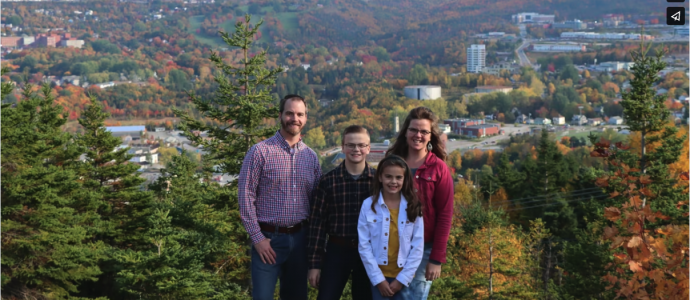 family picture overlooking the city of Corner Brook